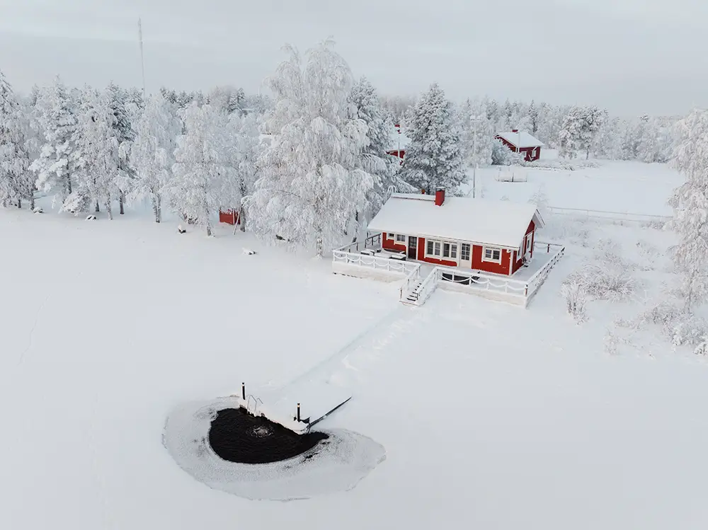 Ice swimming hole on ice in Ranua